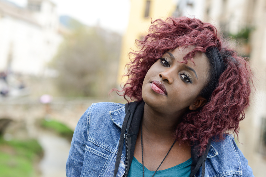 Beautiful Black Woman In Urban Background With Red Hair Role Reboot
